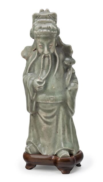 An Unusual Longquan Celadon Figure Of An Official