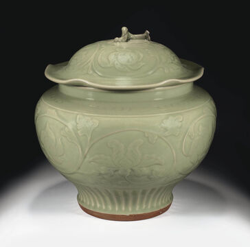 A Carved Longquan Celadon Jar And Cover