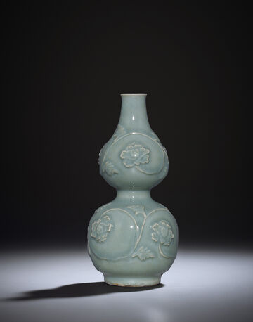 A Rare Moulded Longquan Celadon 'Peony Scroll' Double-Gourd Vase