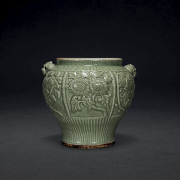 A Rare Finely Carved Longquan Celadon ‘Floral’ Jar