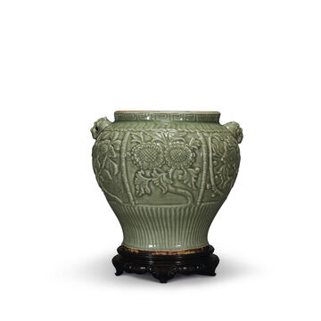 A Rare Finely Carved Longquan Celadon ‘Floral’ Jar
