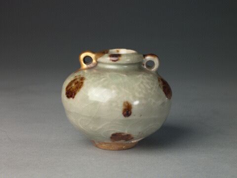 青釉凸花加彩双系罐