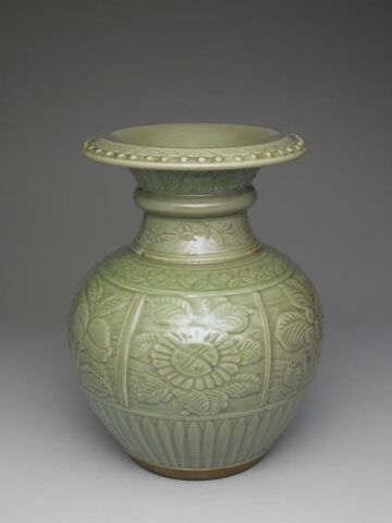 Pomegranate-shaped vessel with raised flowers and fruit decoration