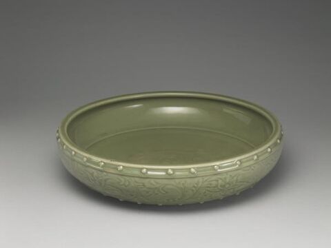 Basin with incised floral and rivet decoration