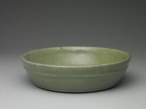 Washer with incised floral pattern