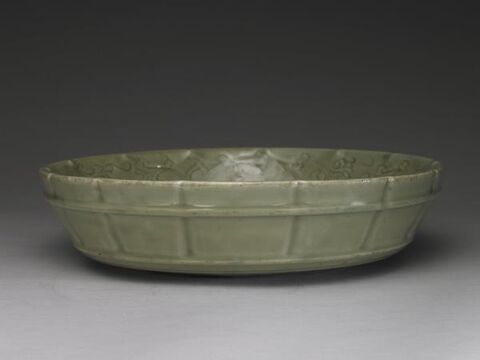 Washer with incised double fish design