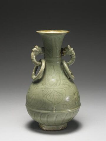 Vase with animal handles holding rings