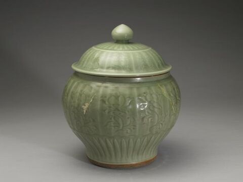 Lidded jar with incised floral decoration