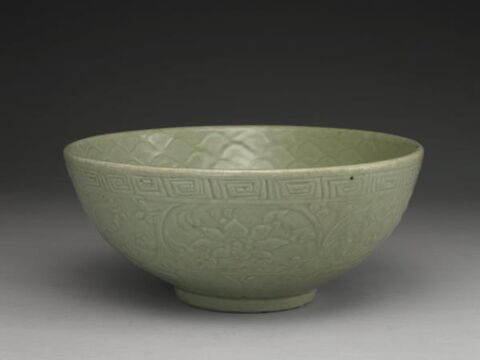 Bowl with carved waves and floral design