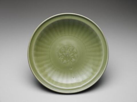 Dish with angled-rim and impressed Indian lotus decoration