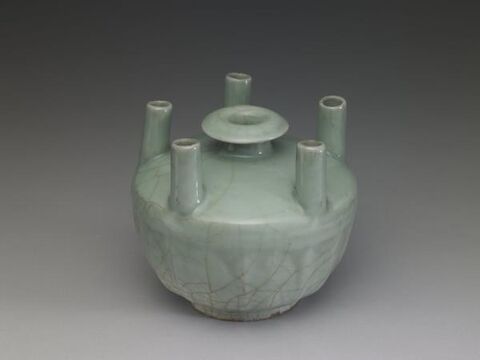 Vase with five tubular protrusions