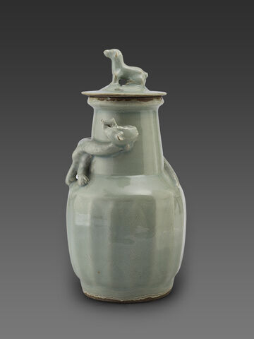 青釉堆龙纹盖罐